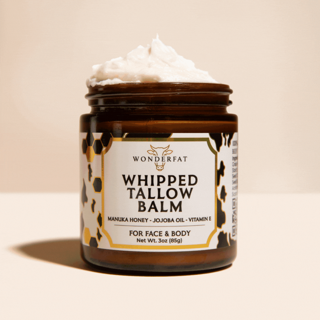 Brown jar labeled 'Whipped Tallow Balm' with creamy white contents.