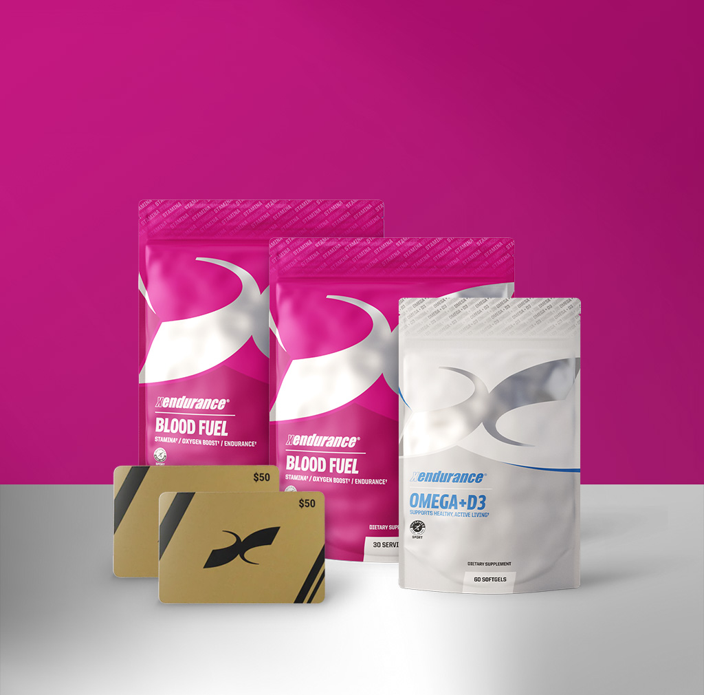 Two pouches of Xendurance Blood Fuel, one of Omega+D3, and two gift cards against a pink background.