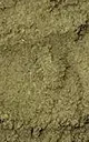 A close-up, textured photograph of a pile of finely chopped, dried green herbs or tea leaves.