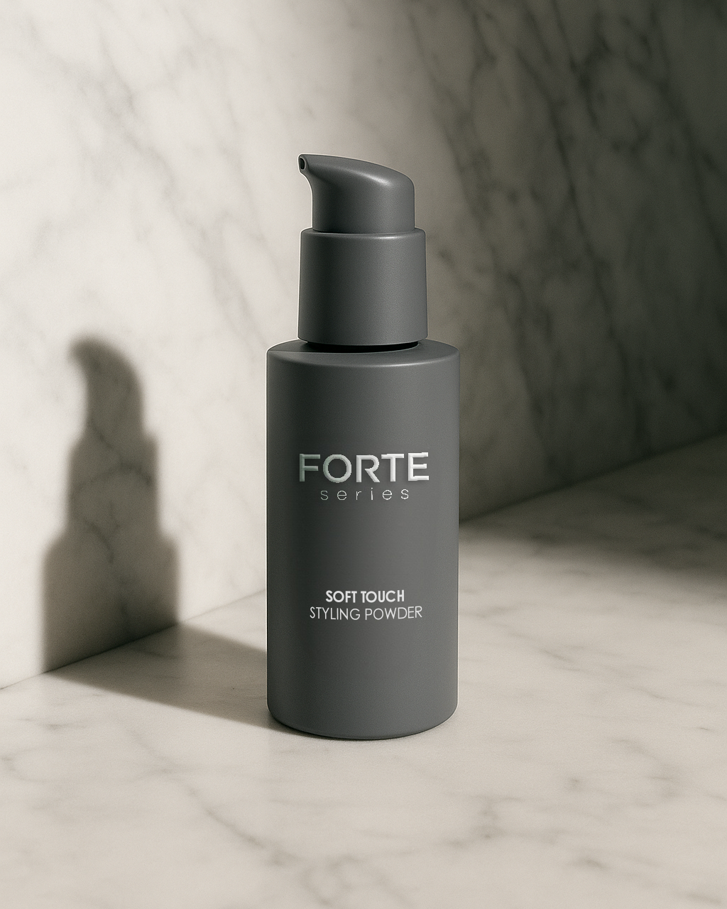 Gray bottle of Forte Series styling powder on marble surface.