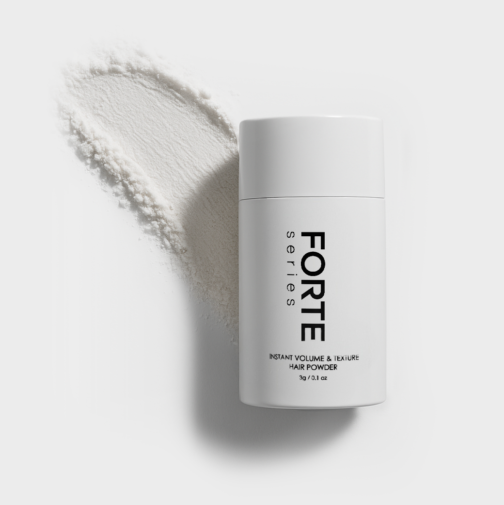 White bottle of Forte hair powder with spilled powder on a white background.