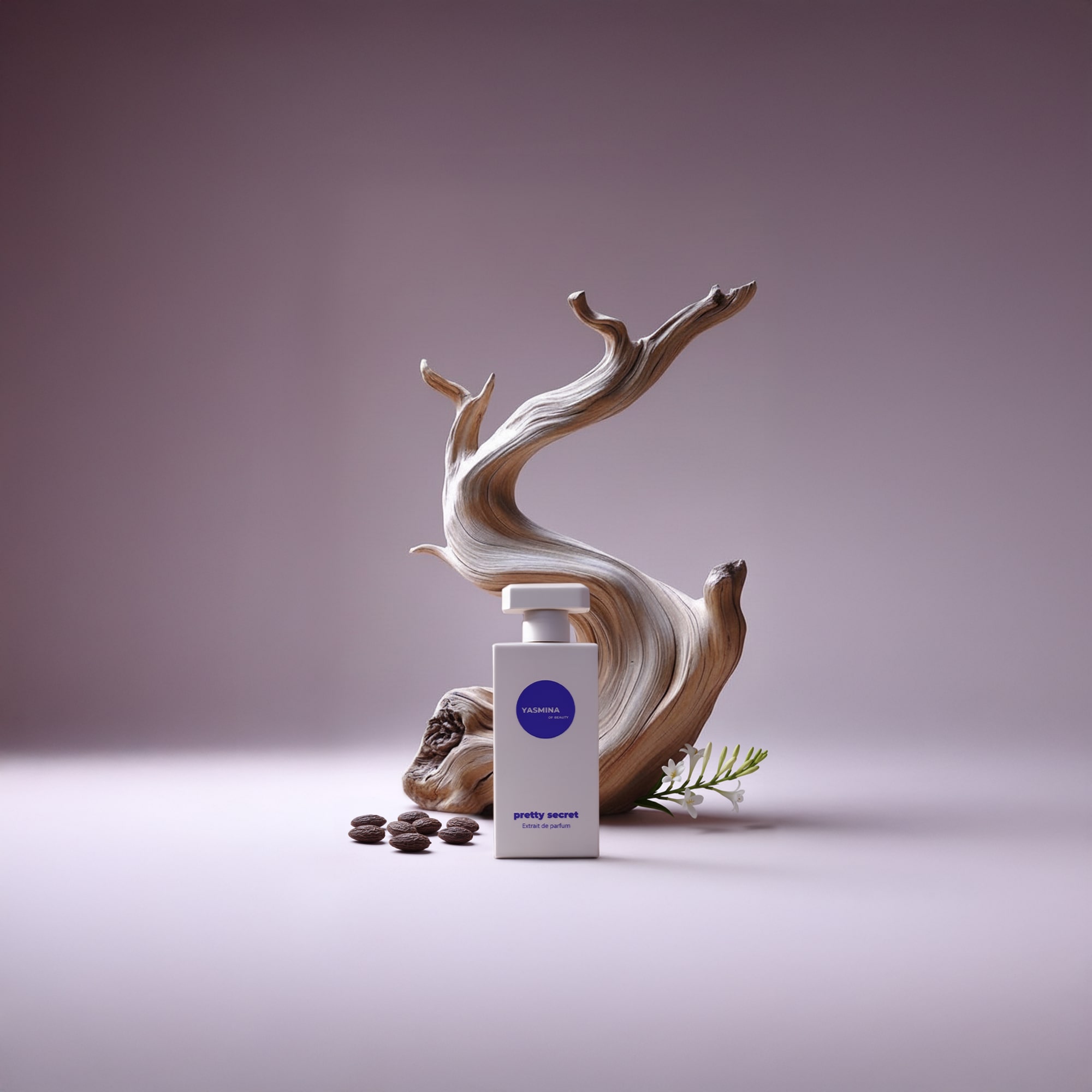 Perfume bottle with decorative driftwood, coffee beans, and a small flower on a purple background.