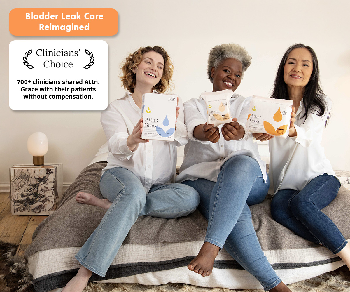 Three smiling women sit on a bed holding packages of Attn: Grace bladder leak care products.