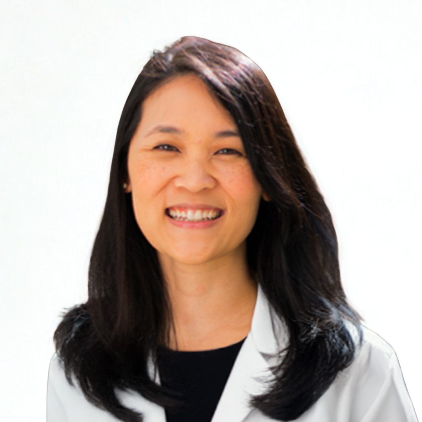 Smiling woman with long black hair wearing a white lab coat.